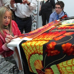 Artisan working on Hermès silk scarf