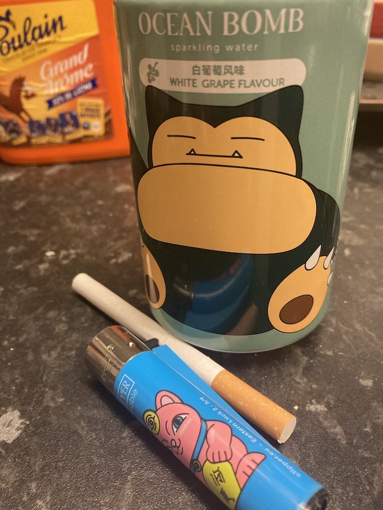 Ocean Bomb drink can and lucky cat lighter