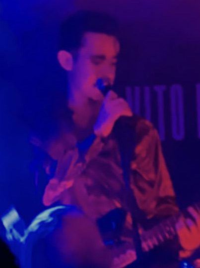 San Vito musician on stage with guitar
