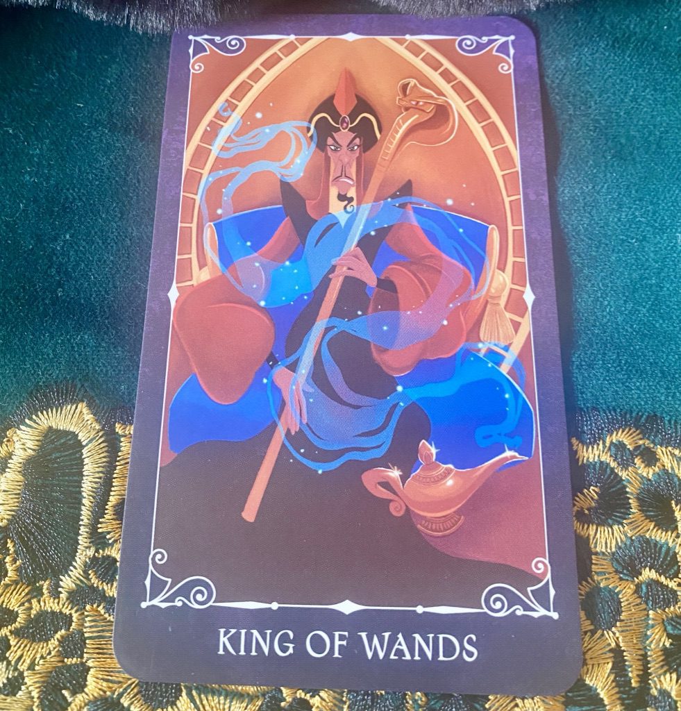 Disney Villains Tarot card shows Jafar from Aladdin sneering imperiously as befits the King of Wands.