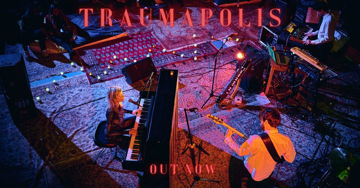 Eva Blanche TRAUMPOLIS promo image Eva Blanche at piano on stage