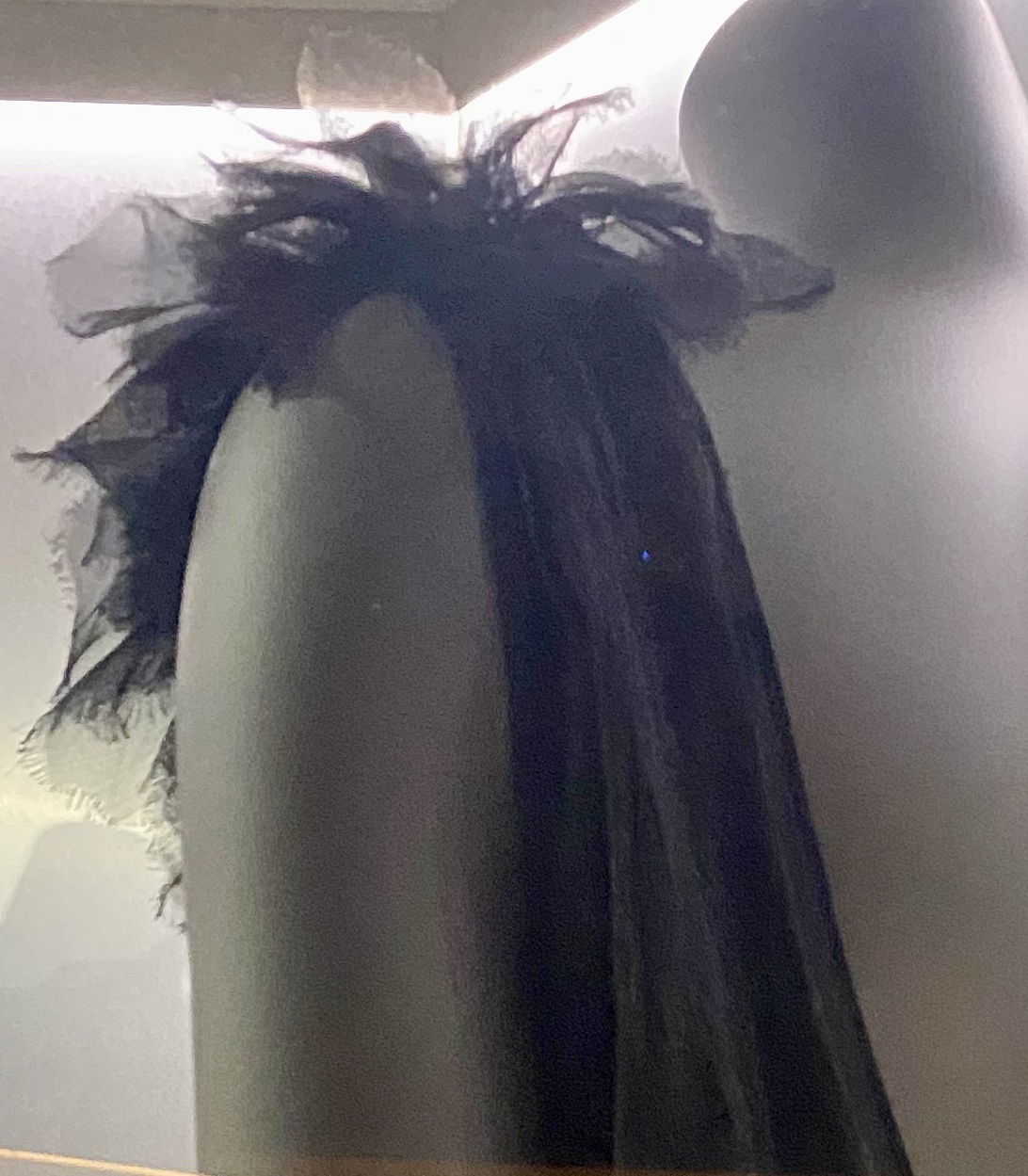 Shoulder detail of a CHANEL black evening dress.
