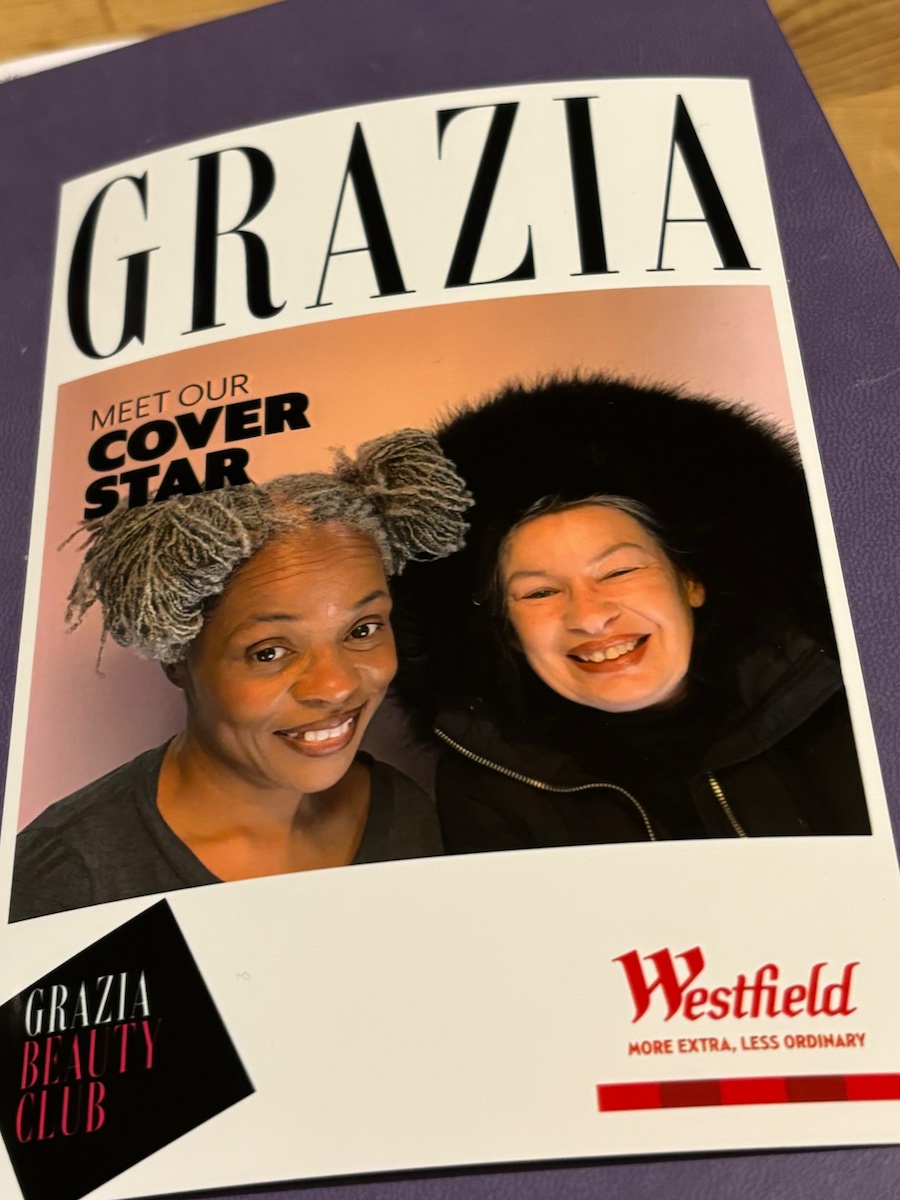 iBeheld and her beautiful friend smiling together in the photo booth at GRAZIA Beauty Edit at Westfield Stratford